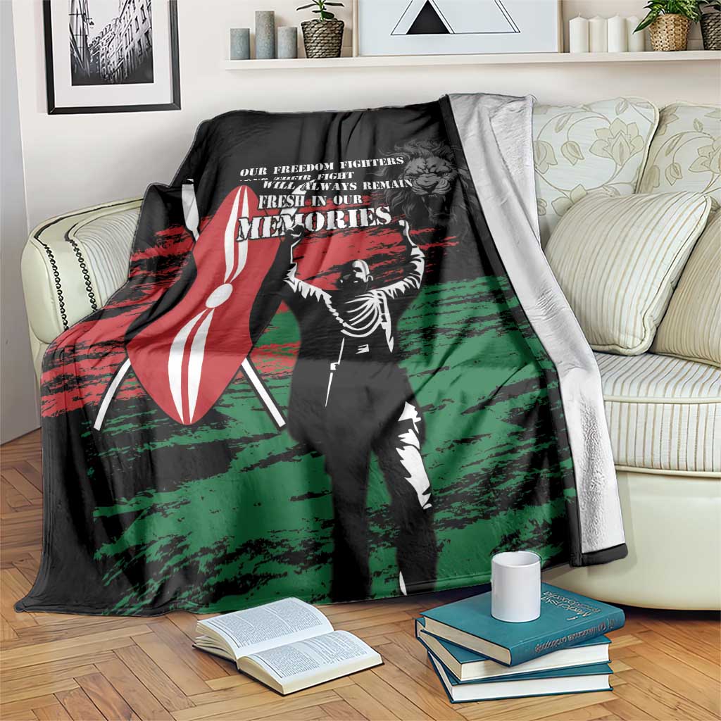 Black Mashujaa Day blanket with red, green, and white hero graphic and text