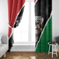Window curtain panels with red, black, and green colors and “Libya Independence Day” print.