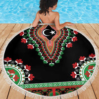 Black round dashiki beach blanket with white fringe and central emblem design