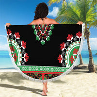 Black dashiki beach blanket with white fringe, round shape, and patterned border