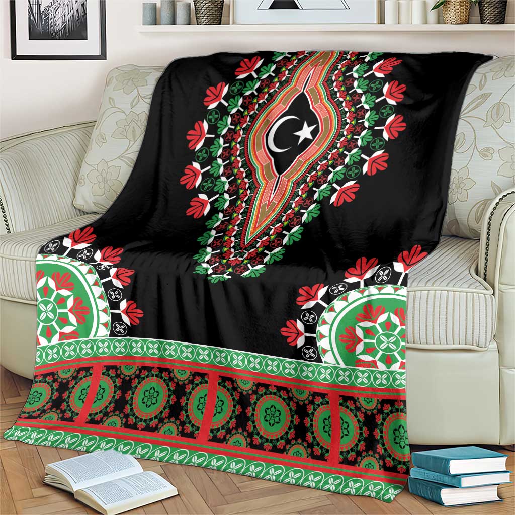 Black dashiki blanket draped over sofa arm, crescent-star center with green-red stripes
