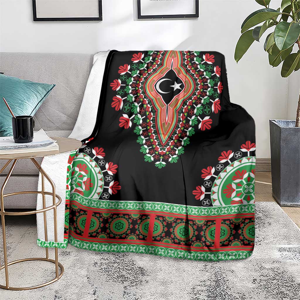 Black dashiki blanket on couch, crescent-star emblem and green-red decorative border