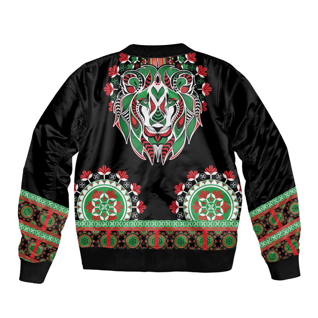 Black bomber jacket with large lion head graphic and green-red dashiki trim band