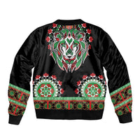 Black bomber jacket with large lion head graphic and green-red dashiki trim band