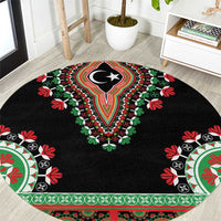 Black round carpet with central crescent-star medallion and red, green floral border