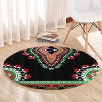 Black round carpet laid on floor, featuring crescent-star center and red-green edge medallions