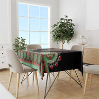 Black tablecloth with green and red dashiki stripe and floral medallion border