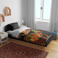 Black Kwanzaa duvet on bed with tribal pattern, candles, and “Happy Kwanzaa” print