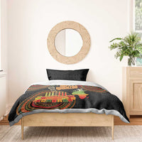 Black Kwanzaa duvet with medallions and “Happy Kwanzaa” candle graphic in bedroom view