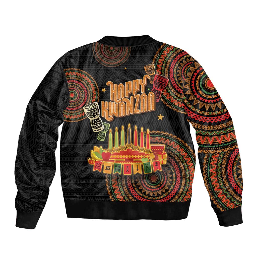 Black bomber jacket with Kwanzaa graphic, tribal pattern sleeves, ribbed cuffs and hem