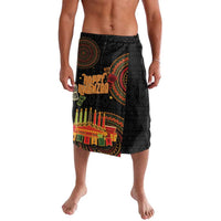 Black knee-length tribal print shorts with colorful Kwanzaa candle graphic panel