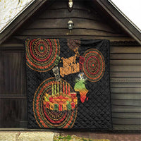 Black Kwanzaa quilt hanging display with circular tribal designs, “Happy Kwanzaa,” and candle centerpiece