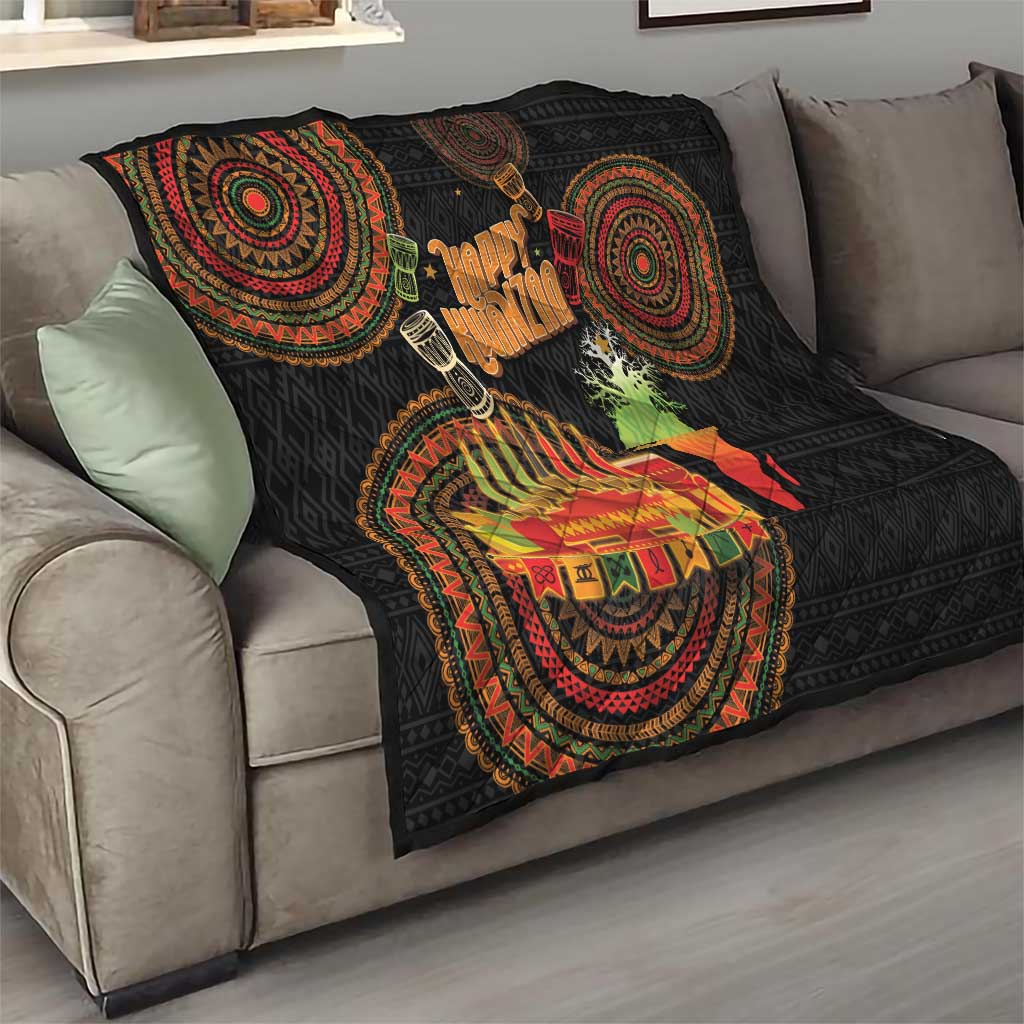 Black Kwanzaa quilt draped on a sofa with circular tribal motifs, “Happy Kwanzaa,” and candle art