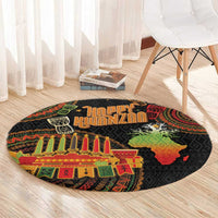 Round black Kwanzaa rug with Happy Kwanzaa lettering, kinara candles and map