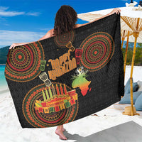 Black sarong with Happy Kwanzaa lettering and circular tribal print, draped flat