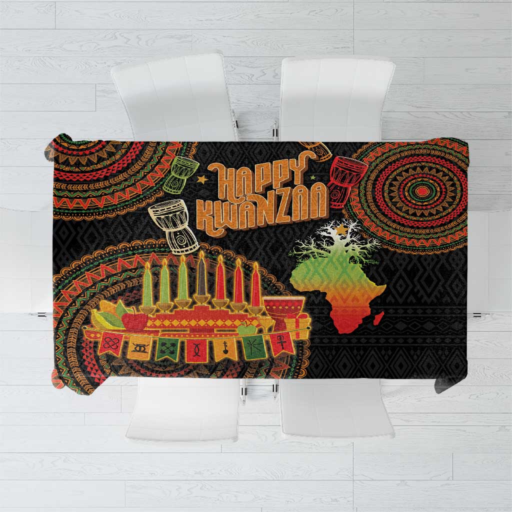 Black tablecloth with colorful tribal motifs, kinara candles, and Kwanzaa lettering