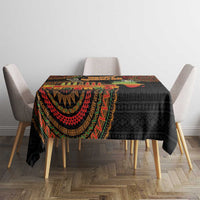 Black tribal tablecloth with colorful semicircle motifs on a square dining table