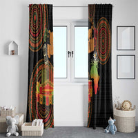 Black Kwanzaa curtain with bold circular medallion pattern, candles, and colorful accents