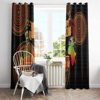 Black curtain panels featuring large circular African tribal pattern and Kwanzaa candleholder