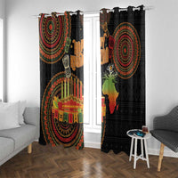 Black window curtain panels with red, green, and orange tribal circles and candle motif