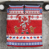 Red Christmas bedding set with Santa and reindeer, “Merry Christmas” text and blue patterned trim