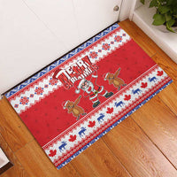 Red Christmas rubber doormat with Santa and groundhog figures, long patterned edge