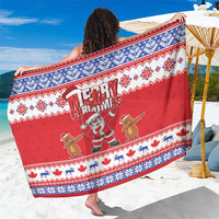Red Christmas sarong with blue patterned border and Santa dabbing graphic