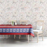 Red and blue holiday tablecloth with snowflake-knit band on dining table
