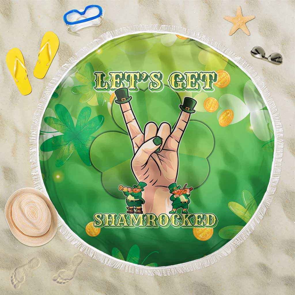 Round green beach blanket with white fringe and clover graphic, "Let's Get Shamrocked".