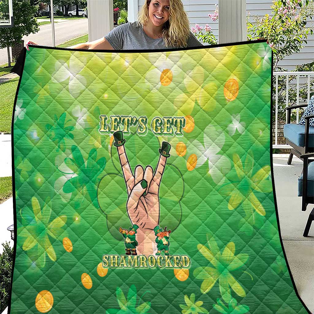 Green St Patrick's quilt with shamrock, coins, and cartoon hand graphic; diamond quilting