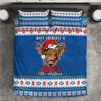Blue Christmas bedding set with Highland cow graphic, patterned border and pillowcases