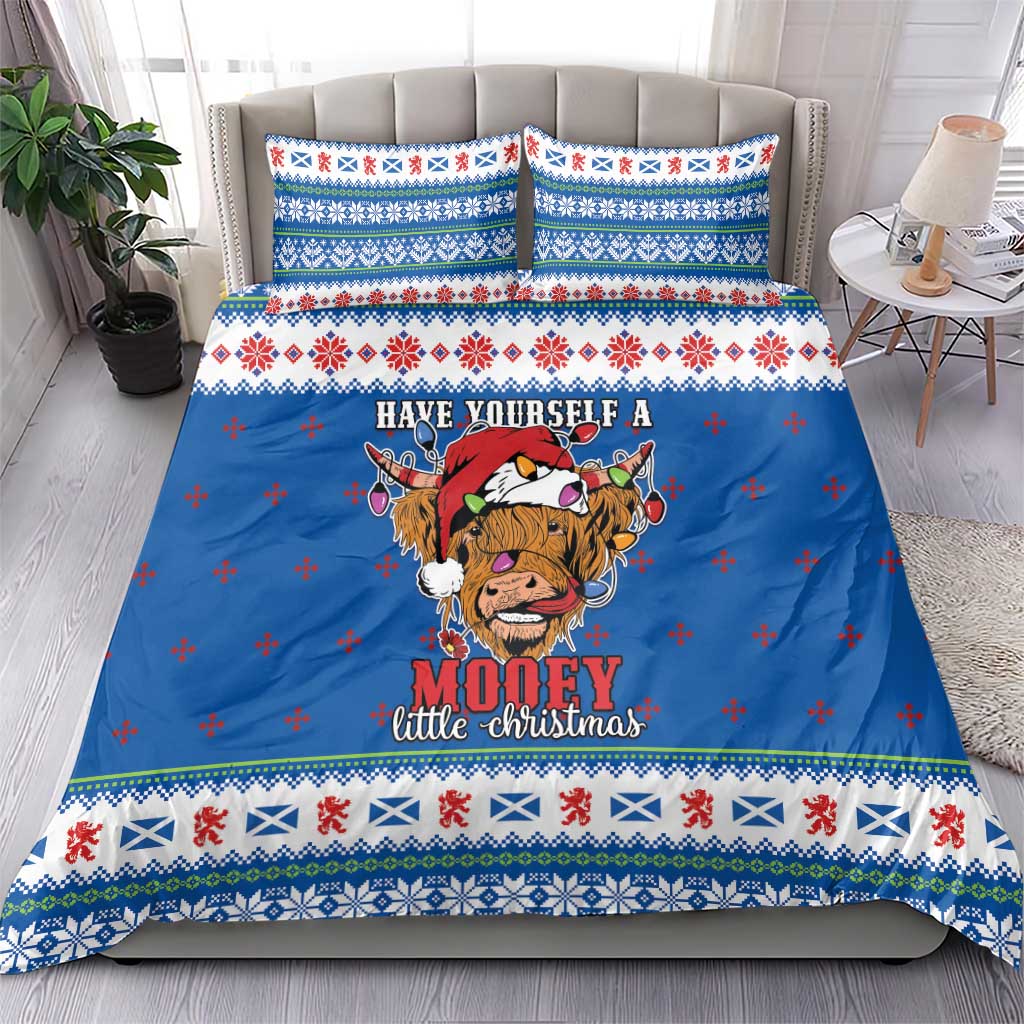 Blue Christmas bedding set with Highland cow design, festive fair-isle style stripes
