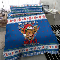 Blue Christmas quilt bedding set with centered Highland cow and Fair Isle border