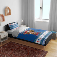 Blue Christmas bedding set on bed with Highland cow duvet and matching pillow covers
