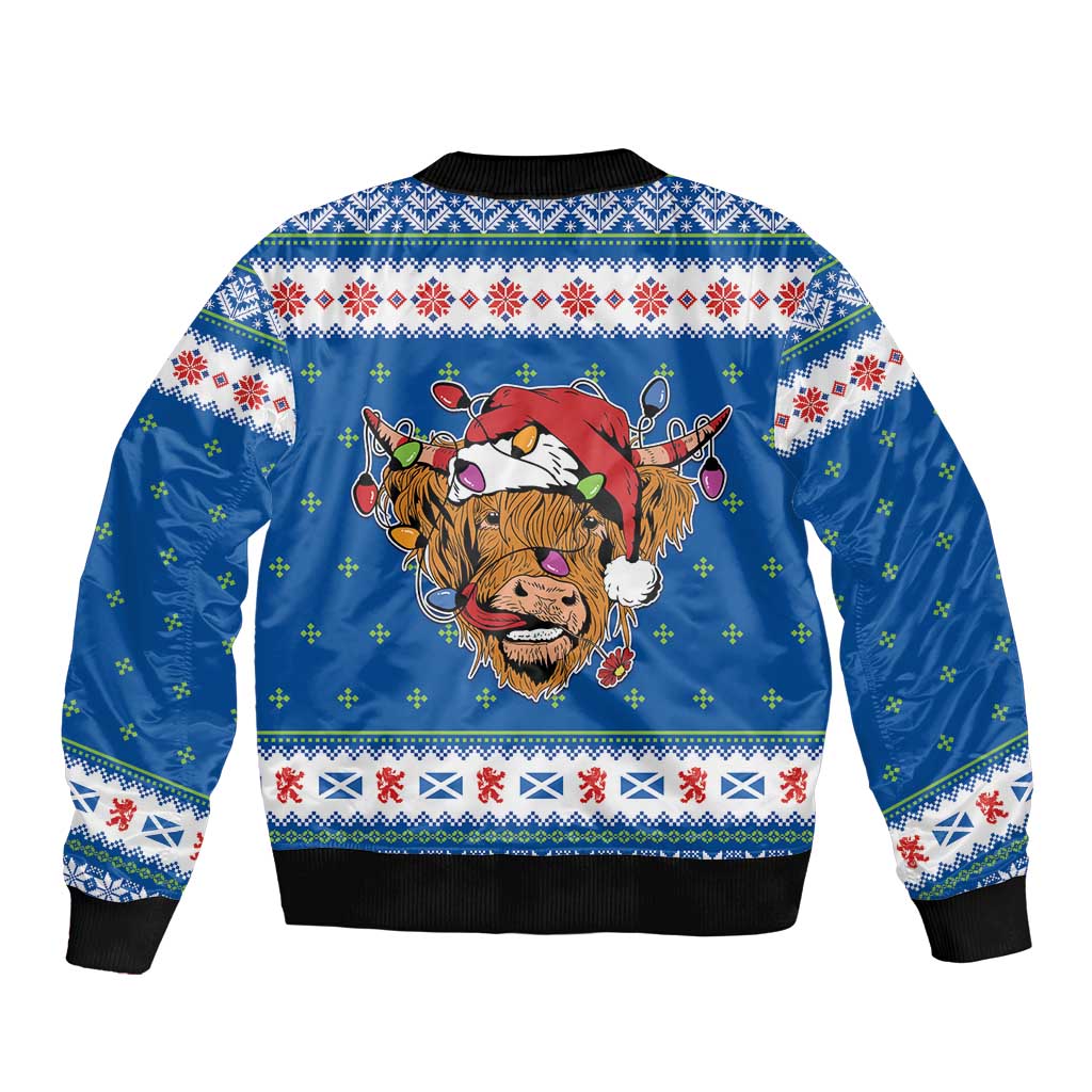 Unisex blue bomber jacket with back Highland cow Christmas graphic and knit cuffs