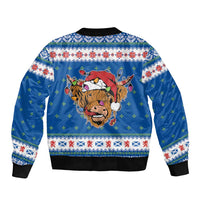 Unisex blue bomber jacket with back Highland cow Christmas graphic and knit cuffs