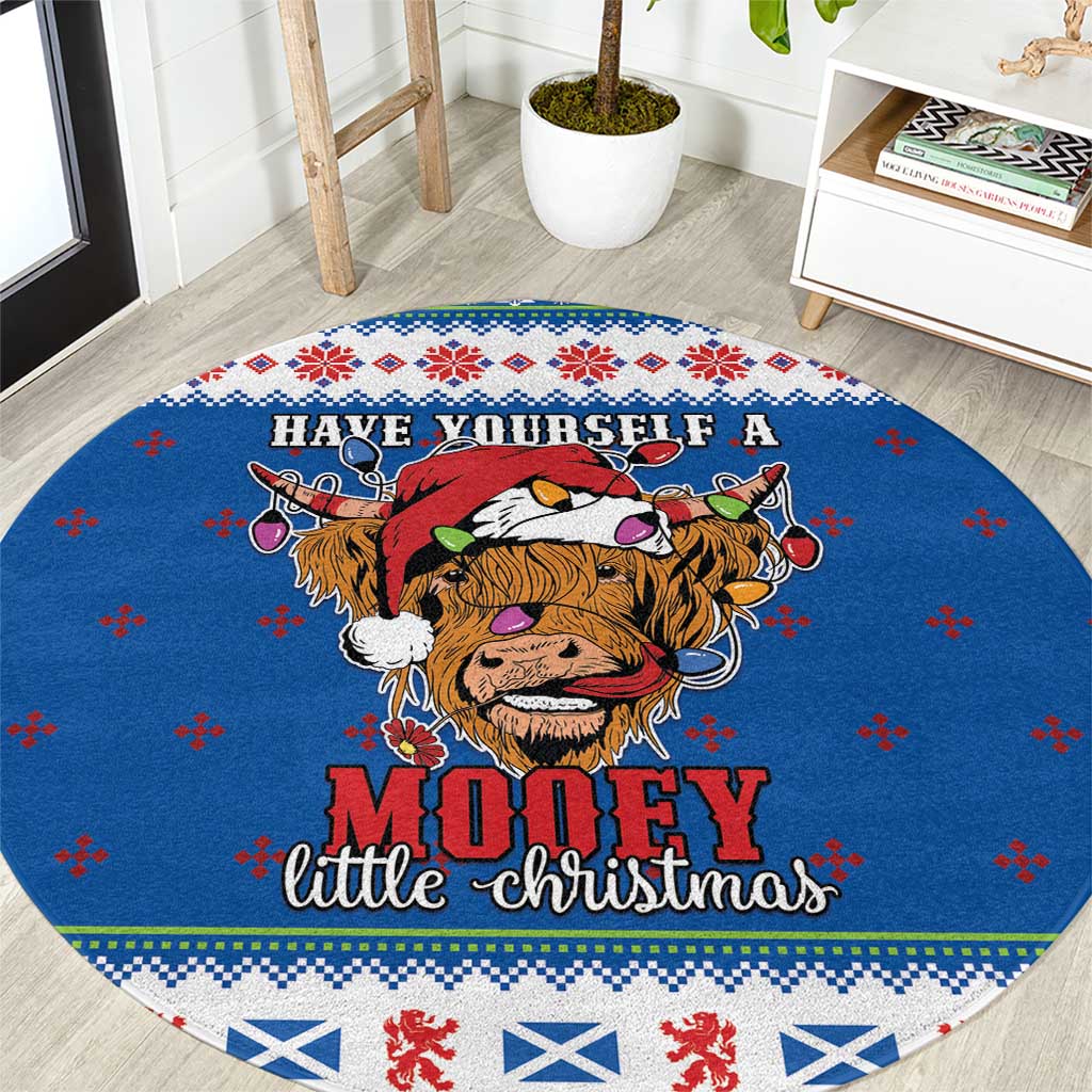 Blue round Christmas rug with Highland cow graphic and "Mooey" holiday text