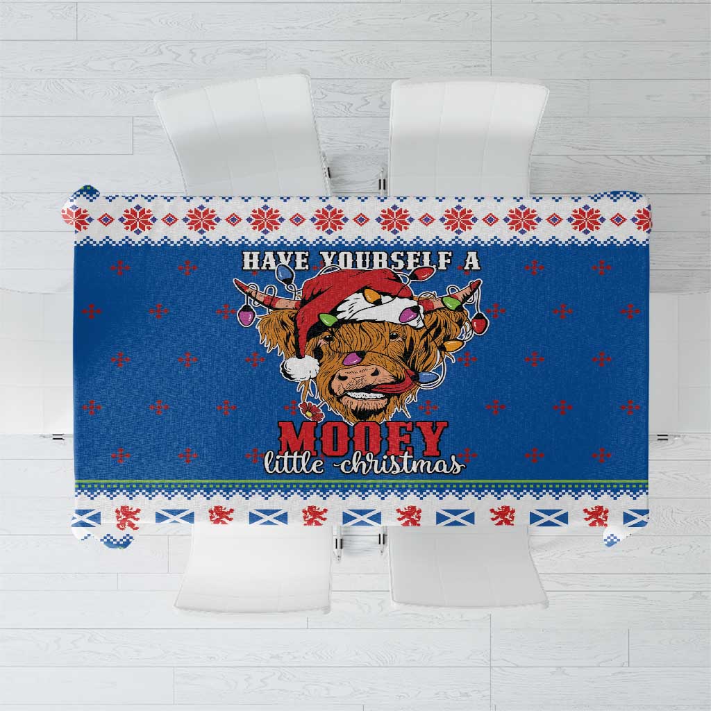 Blue Christmas tablecloth with Highland cow, snowflake and plaid border design
