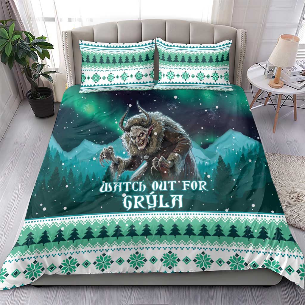 Teal and green Christmas duvet set with monster graphic, pine borders, and matching pillowcases