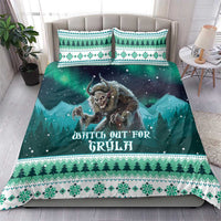 Teal and green Christmas duvet set with monster graphic, pine borders, and matching pillowcases