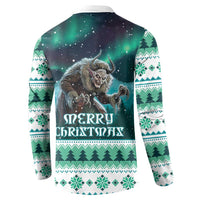 Green button sweatshirt with Merry Christmas Gryla graphic on the back and tree border