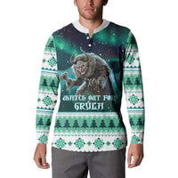 Green Christmas button henley sweatshirt on model with Gryla chest graphic and patterned hem