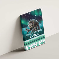 Green canvas wall art mounted on a wall, horned monster with “WATCH OUT FOR GRYLA” text