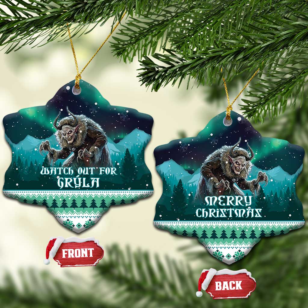 Two ceramic Christmas heart ornaments hanging from pine branches, Gryla and “Merry Christmas”