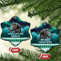 Two ceramic Christmas heart ornaments hanging from pine branches, Gryla and “Merry Christmas”