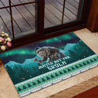 Holiday rubber doormat with green night forest illustration, triangular border, and figure