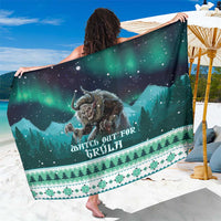 Green Christmas sarong with starry night, Gryla-style figure, and forest border