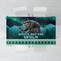 Green Christmas tablecloth with Gryla witch print, starry night, and holiday icons