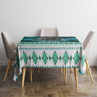 Green and teal Christmas tablecloth with winter tree and snowflake band pattern