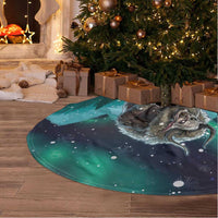 Green round tree skirt with white trim, wolf artwork and snowy night print